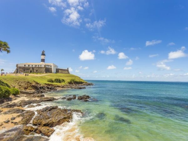A wide picture of the Barra's Lighthouse in Bahia, Brazil, taken in a bright and beautiful day. Colorful and satured taken with a Canon 6D.